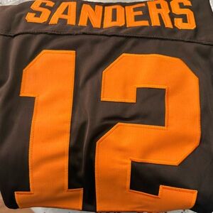 Brown and Orange Jersey with Number 12